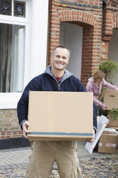 Movers loading a van in Holloway on a residential street