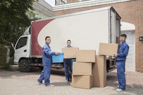 Professional Holloway removals team loading furniture into a van