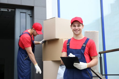 Professional movers loading special items for a Holloway move