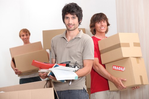 Professional movers handling commercial office furniture in Holloway