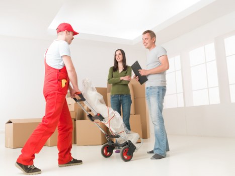 Loading household items into a van for a Holloway move