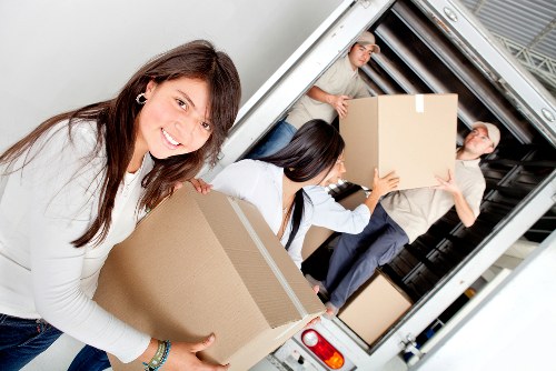 Worker reviewing safety procedures beside a loaded van