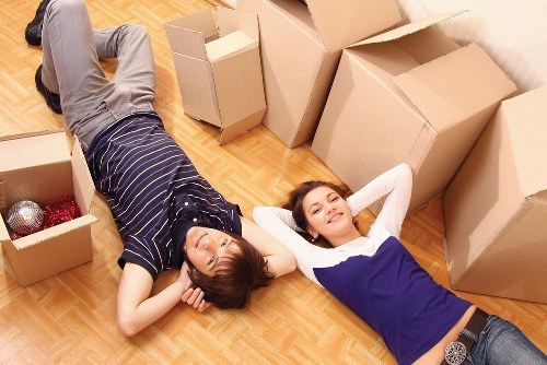 Apartment moving team handling furniture in Holloway