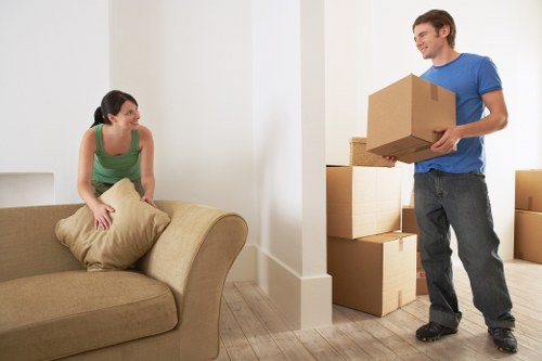Local Holloway removals crew unloading boxes and furniture at a new property