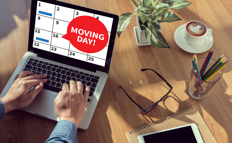 Local moving team organizing items in a North London property